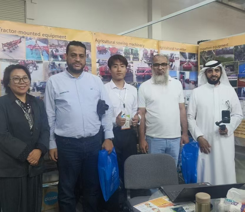 Arab customers visiting Sunto Machinery agricultural equipment booth at trade show