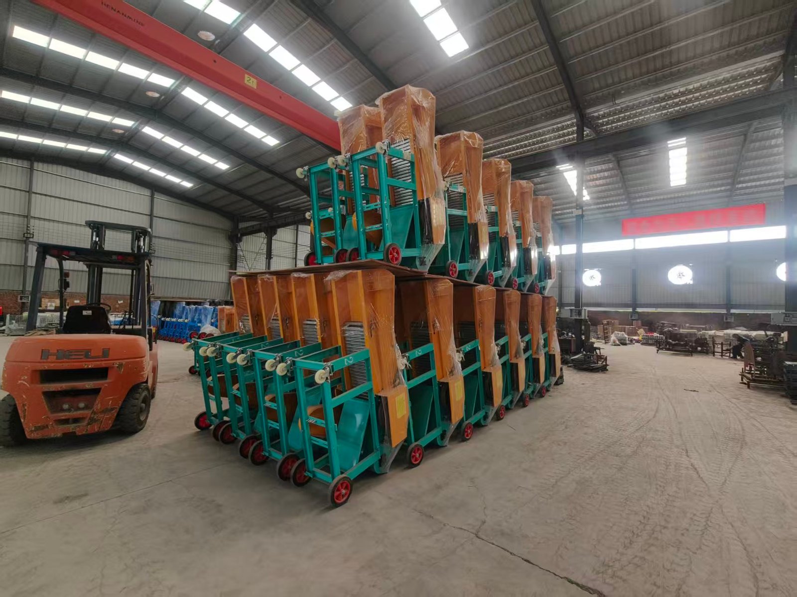 Batch of Sunto chaff cutter machines packed and stacked in warehouse ready for export