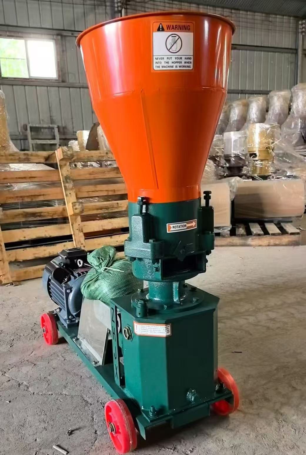 Sunto KLJ160 flat die feed pellet machine with orange hopper before packing for Kenya customer